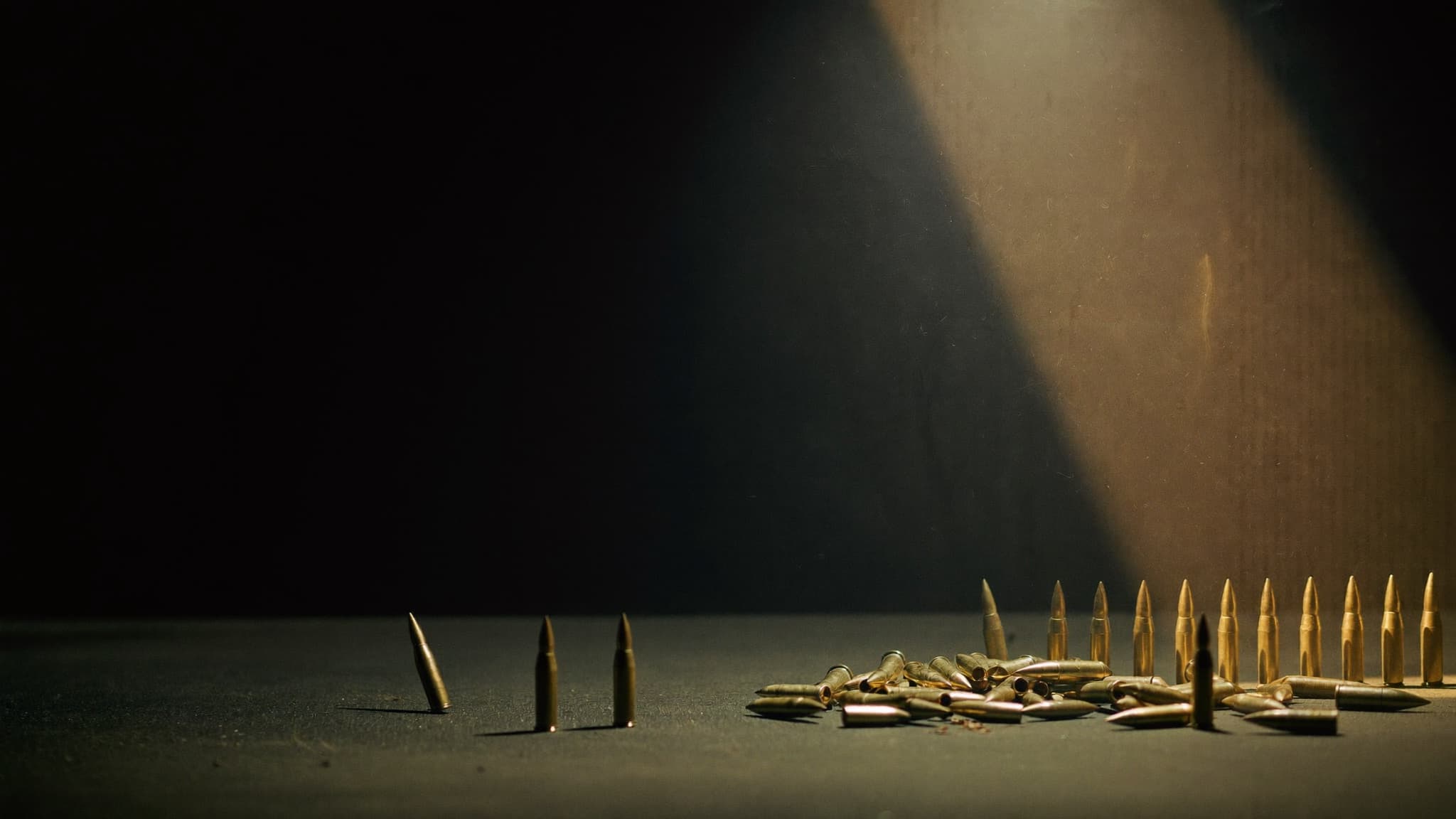 Brass ammunition cartridges under dramatic studio light